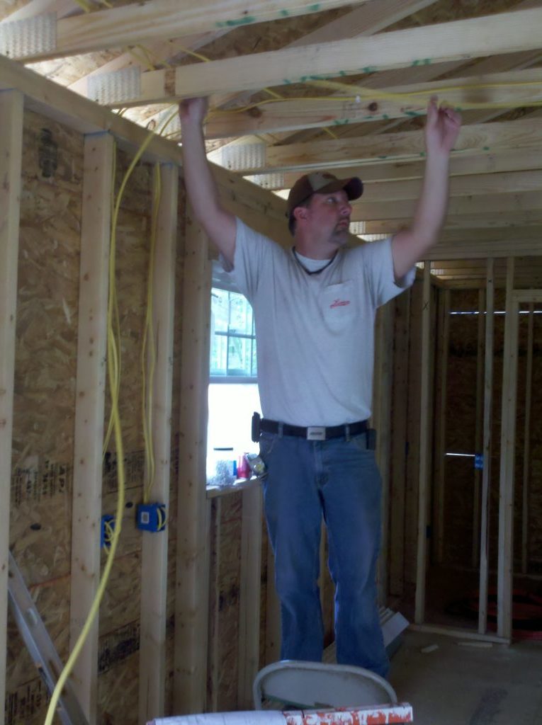 Volunteer hanging wire